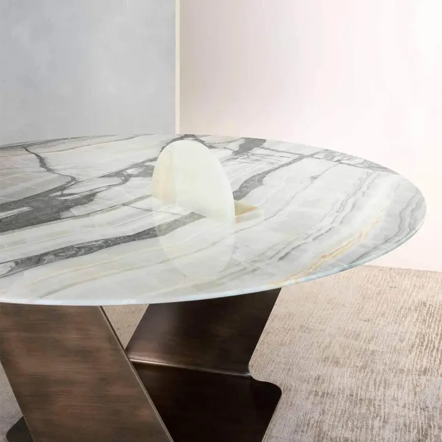 Distinguished Rugiano Wally table with swirling grey and white marble top and varnished bronze sculpturesque metal base