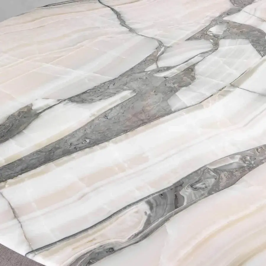 Exclusive Rugiano Wally table with white and beige tones exhibiting gray veining in decorated painted wood or marble and varnished bronze base