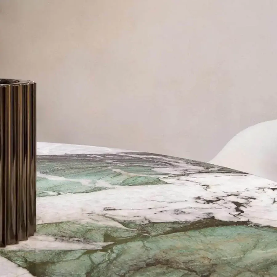 Exceptional Rugiano Wally table with captivating white, green and dark grey marble top and varnished bronze metal base