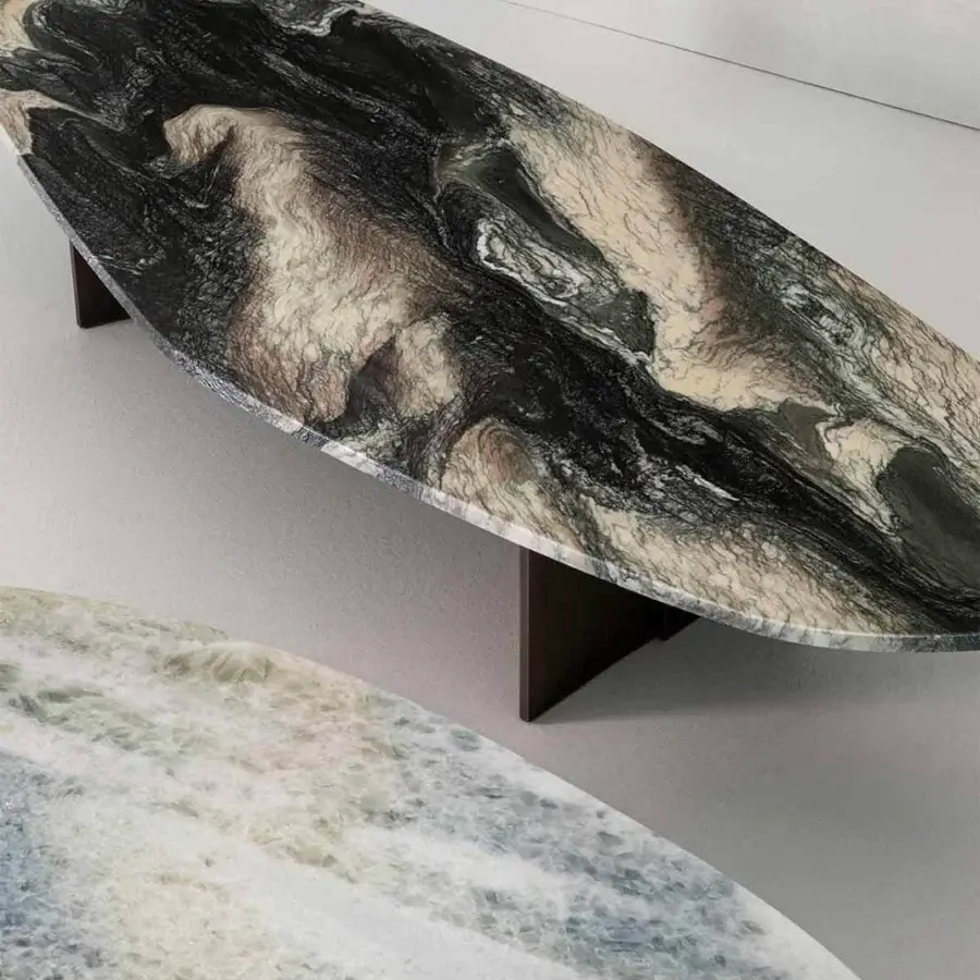 Superior Rugiano Rock coffee table with an elongated oval marble top and bronzed brass metal legs