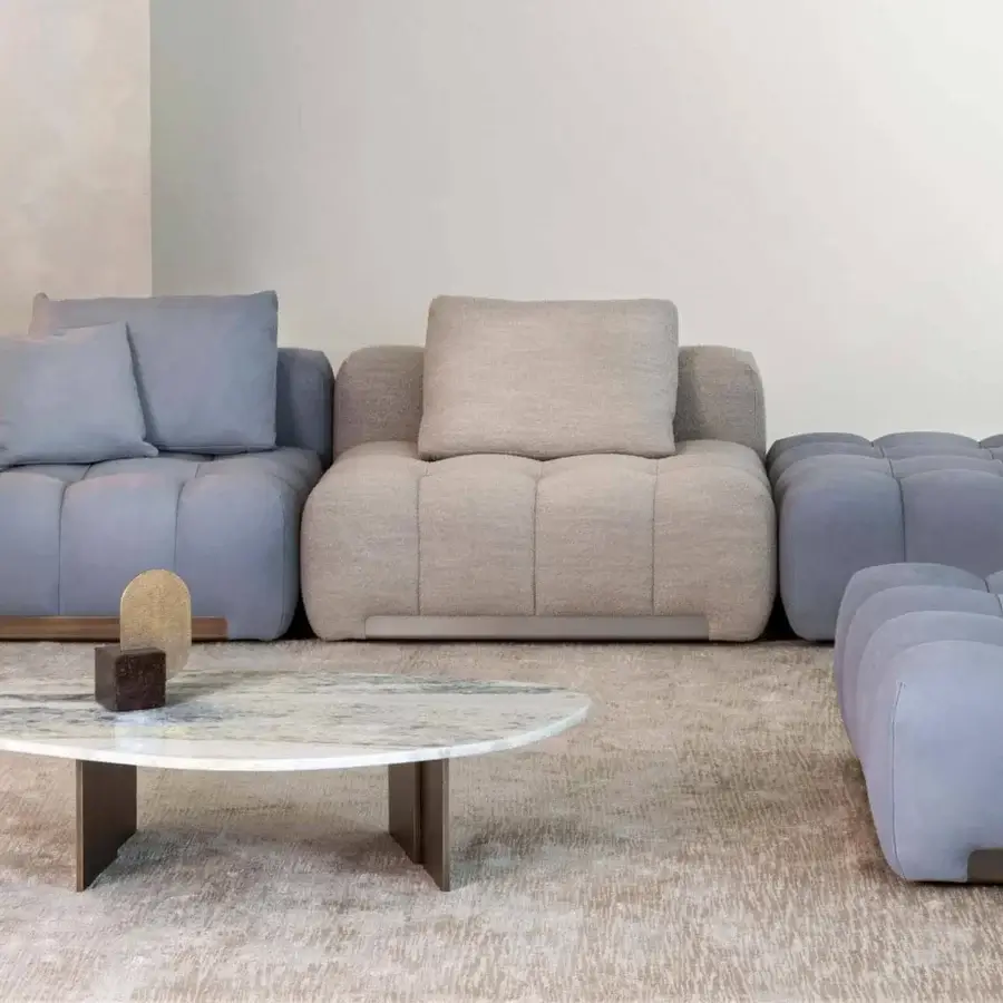 Elegant Rugiano Rock coffee table with a white and light blue marble-like shaped top and bronzed brass metal legs