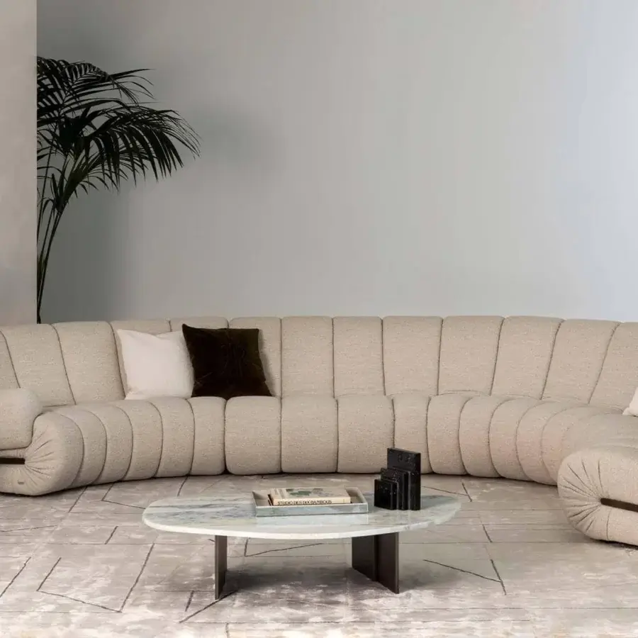 Innovative Rugiano Rock coffee table with a light gray and white marble effect top and bronzed brass metal legs crafted with a polished finish