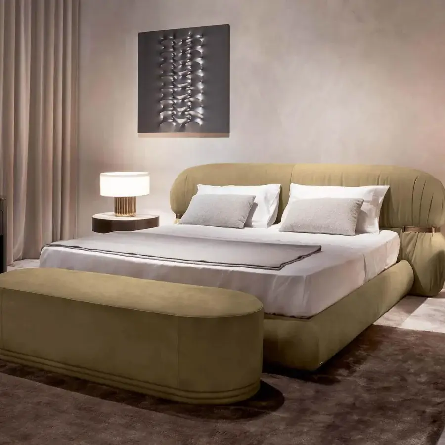 Lavish Rugiano Fandango bed upholstered in muted olive-green textured leather with bronzed brass metal embellishment