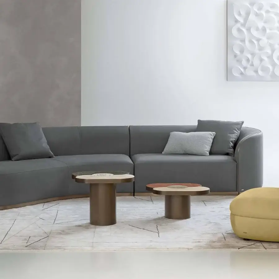Distinguished Rugiano Landmark coffee table with bronzed brass metal and light tan composite, showcasing brown tones