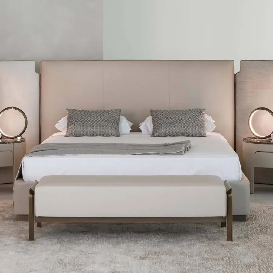 Superior Rugiano Falcon bed with vertical panels upholstered in light beige textile and bronze brass finish