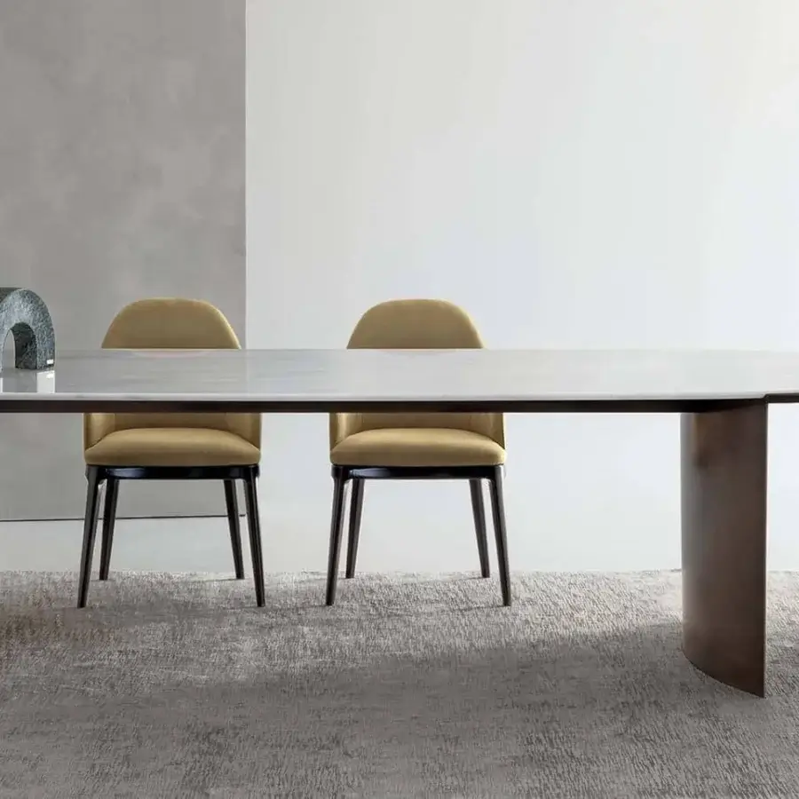 Distinguished Rugiano President table with light gray stone-like surface and varnished bronze curved legs