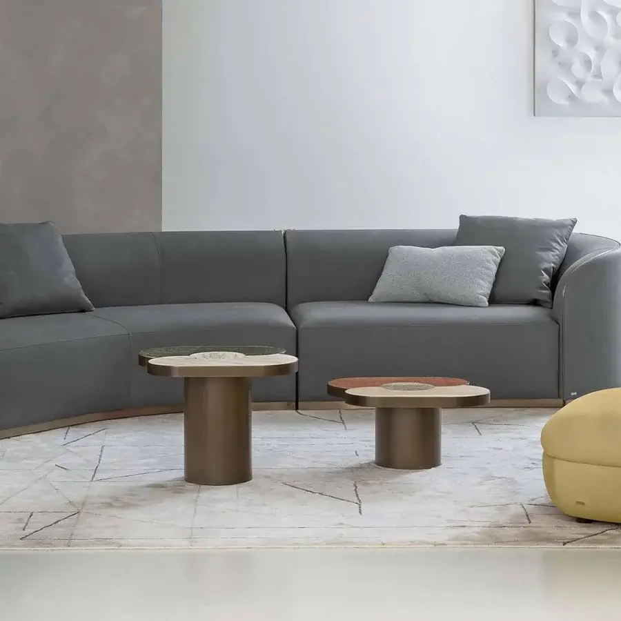 Distinguished Rugiano Fandango lounge chair upholstered in muted golden textile with a matte finish and bronze brass metal band