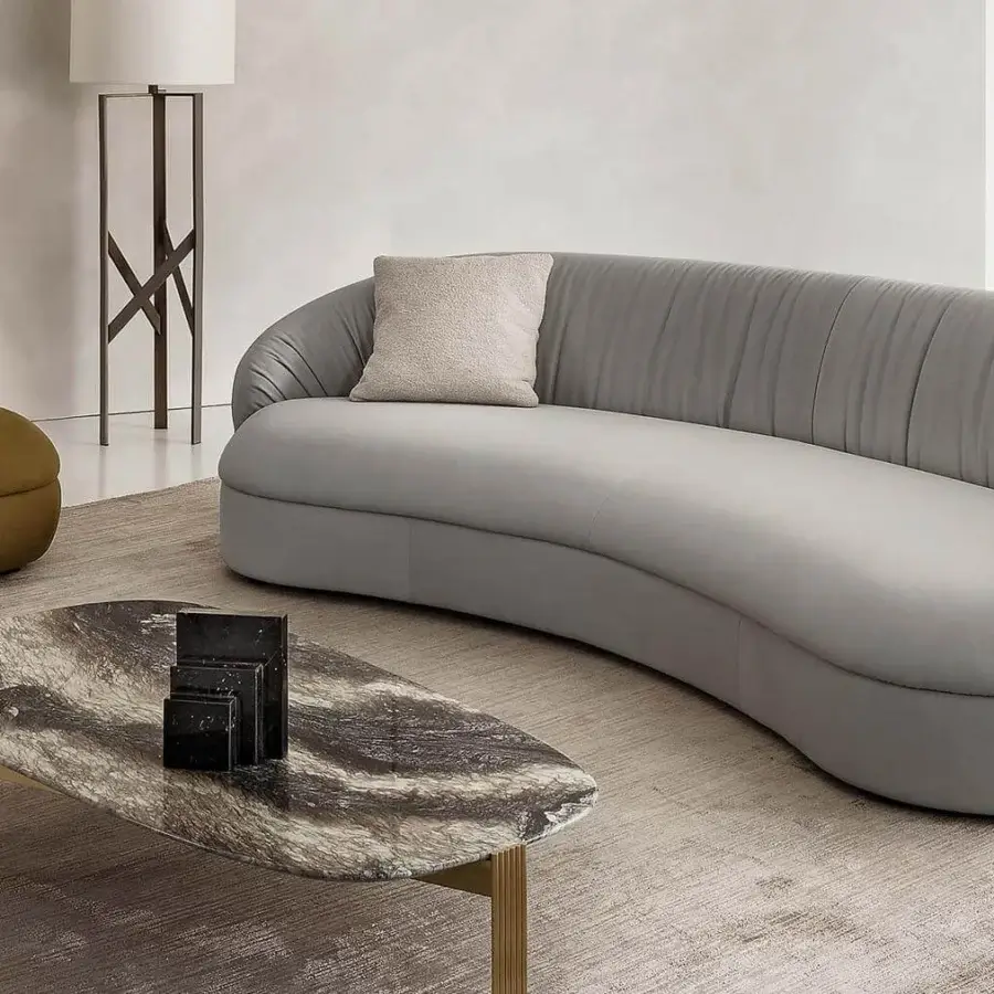 Exclusive Rugiano Fandango sofa with a curved silhouette and smooth light gray leather upholstery