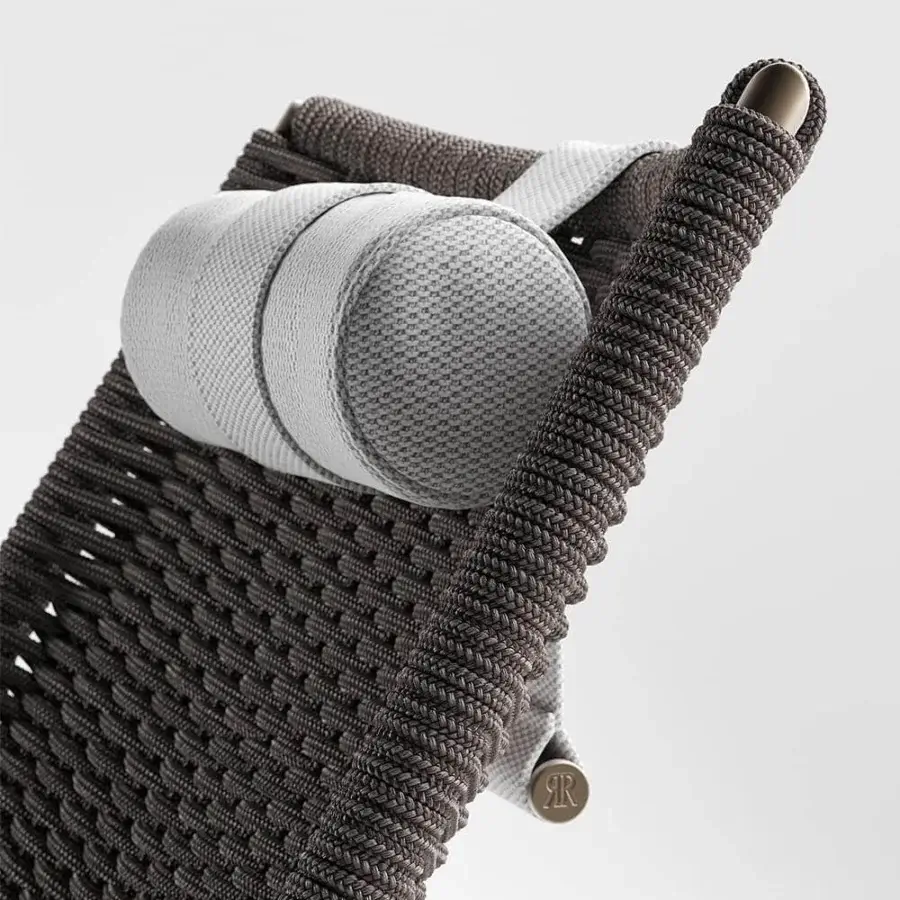 Distinguished Rugiano Playa lounger with black metal structure and intricately hand-braided black rope complemented by a light grey cushion