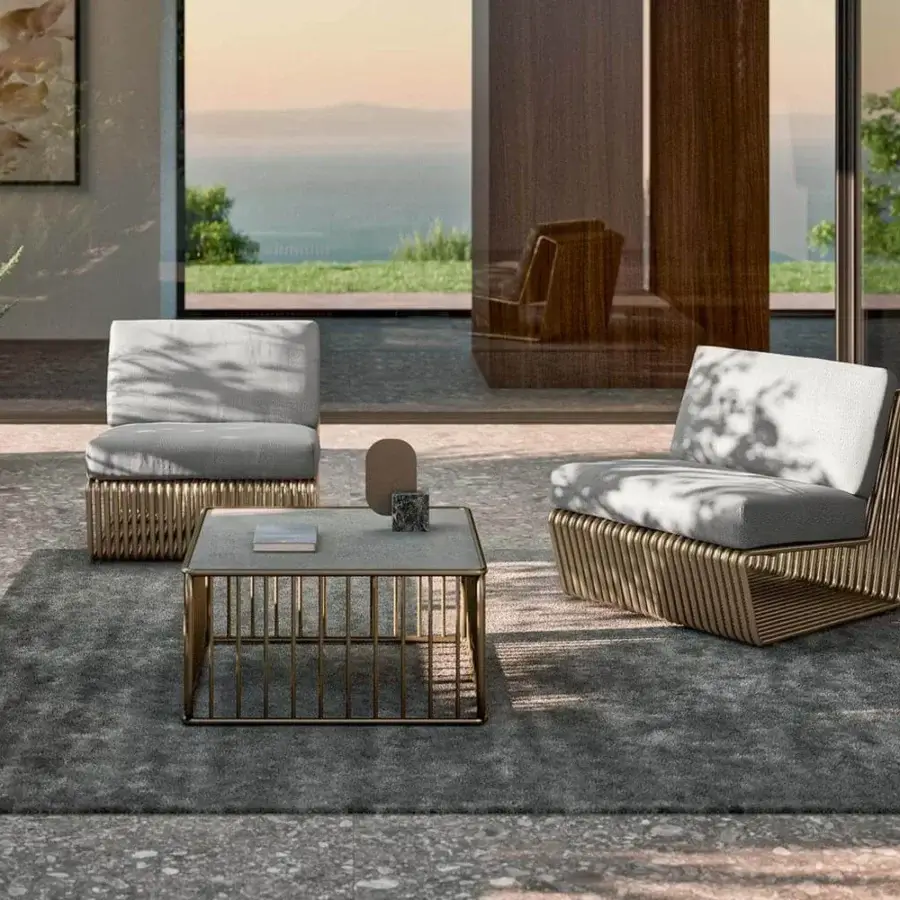 Distinguished Rugiano Infinity lounger with light grey outdoor cushions and bronze aluminum frame built with hand-finished gold varnish