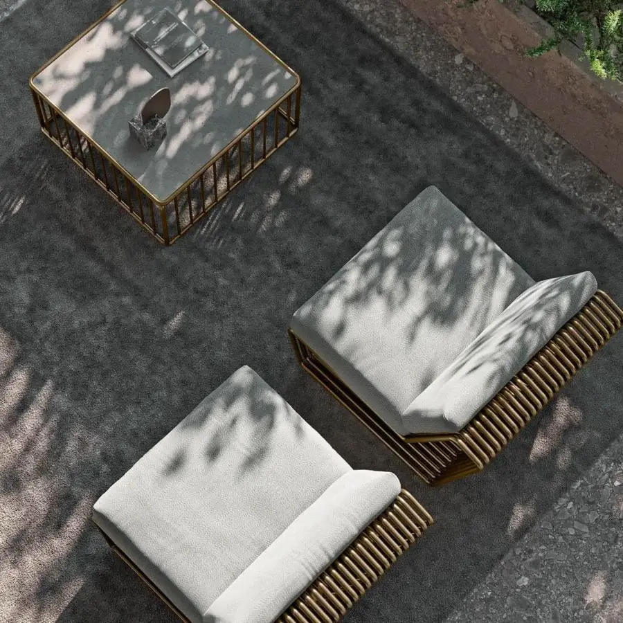 Elegant Rugiano Infinity lounge chair with light gray textile cushions and bronze aluminum sculptural frame
