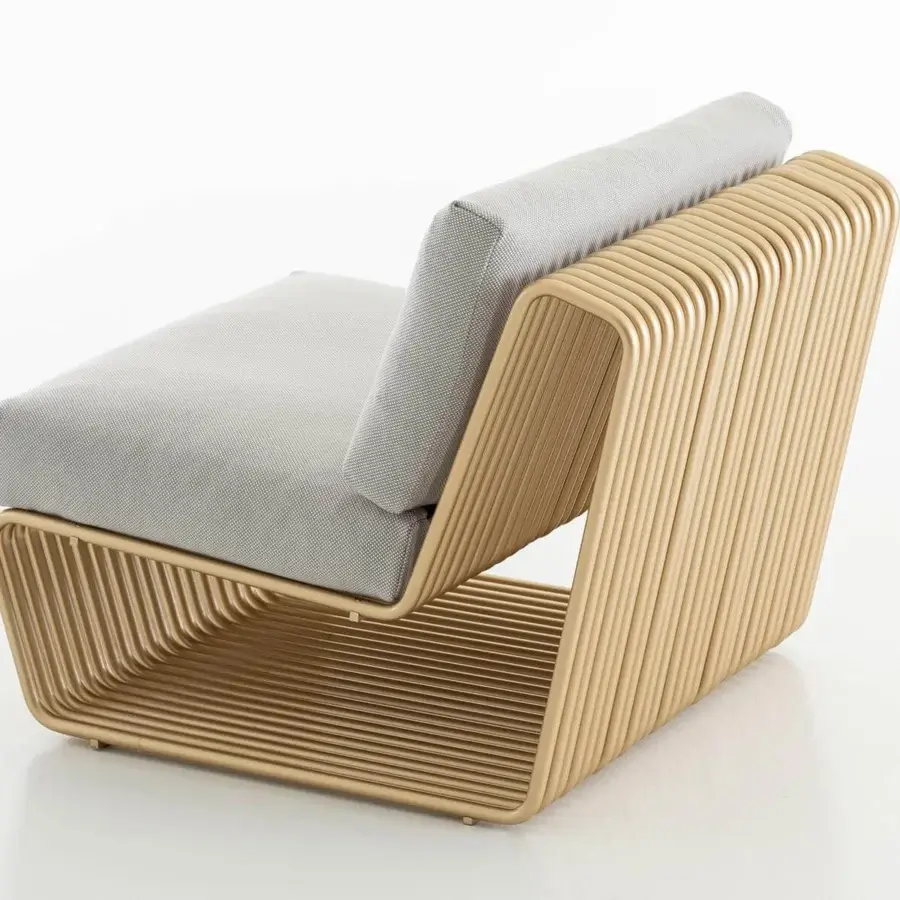 Superior Rugiano Infinity lounge chair with textured grey cushions and varnished gold hand-finished bronze aluminum components
