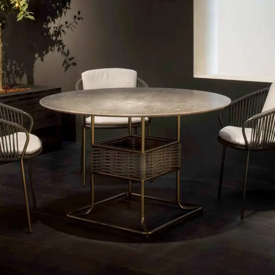 Superior Rugiano Minerva armchair with outdoor bronze metal and hand-braided grey rope detailing, built with light-colored cushions
