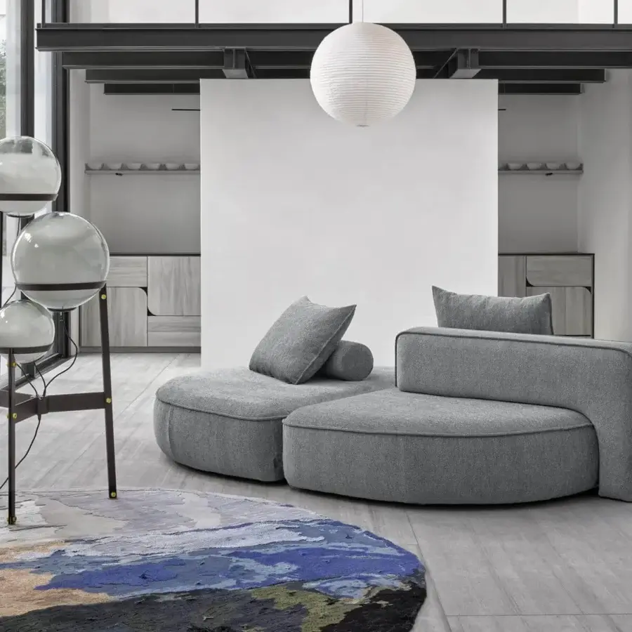 Superior Arketipo Back Pack sectional in uniform gray textile with a matte finish and rounded organic form