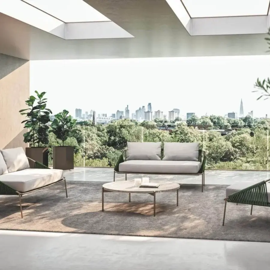 Distinguished Rugiano Demetra sofa with hand-braided metal structure and light gray fabric cushions in a dark matte finish