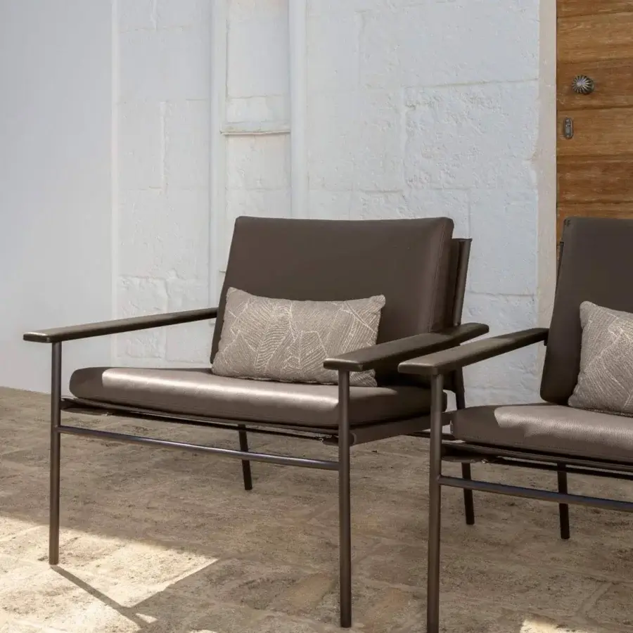 Sophisticated Talenti Allure lounge chair with dark brown steel and eco-leather, plus wooden finishes and a neutral cushion