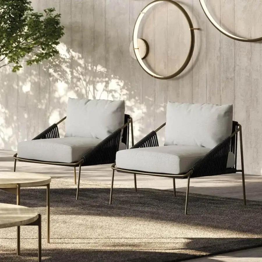 Distinguished Rugiano Demetra lounge chair with light gray fabric cushions and gold-tone metal woven with dark synthetic rope