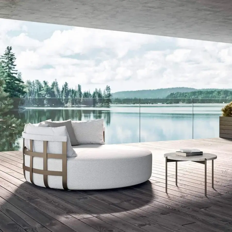 Elegant Rugiano Dafne daybed with bronze-painted aluminum basket and light gray textured fabric cushions for outdoor lounging