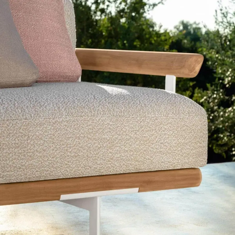 Distinguished Talenti Allure sectional with light beige textile, light gray and pale pink cushions, plus white aluminum feet and solid wood frame