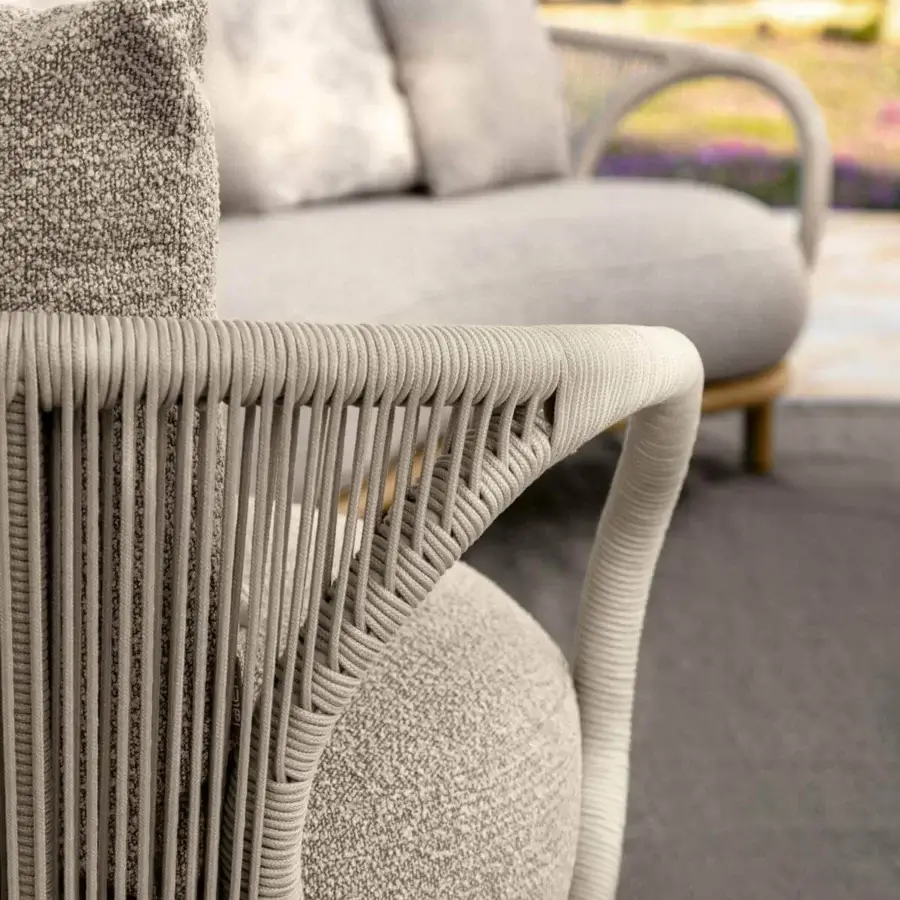 Stylish Talenti Karen sofa with enveloping shapes and curved lines, crafted in light gray synthetic fiber weaving