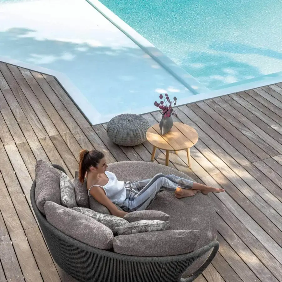 Exceptional Talenti Karen daybed with a cocoon design and handcrafted woven backrest upholstered in varying tones of grey patterned textile