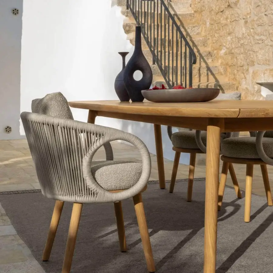 Distinguished Talenti Karen armchair crafted in Italy with gracefully curved lines and light beige woven fabric legs