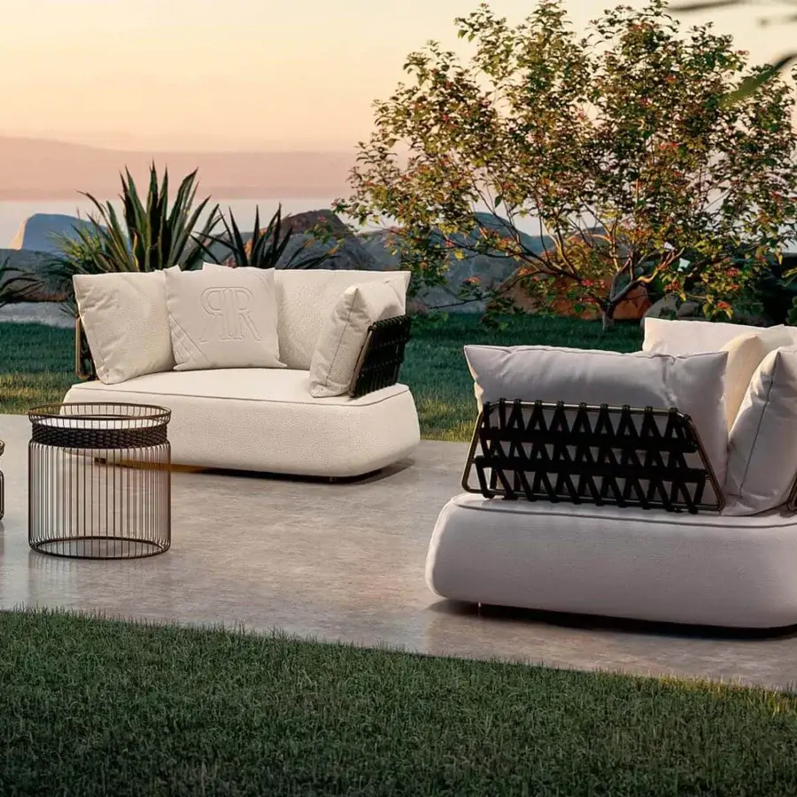 Exceptional Rugiano Melody lounge chair with creamy white cushions and a meticulously woven dark metal backrest crafted in Italy