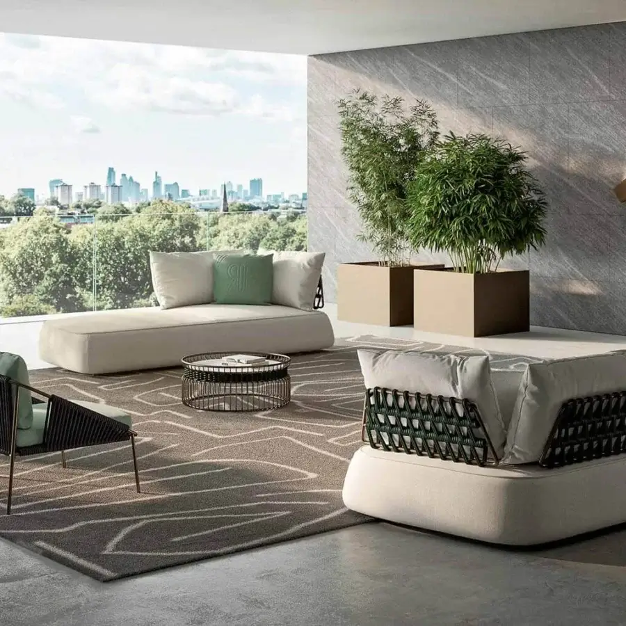 Sophisticated Rugiano Melody chaise lounge with light-colored fabric, white metal, and light grey woven rope construction