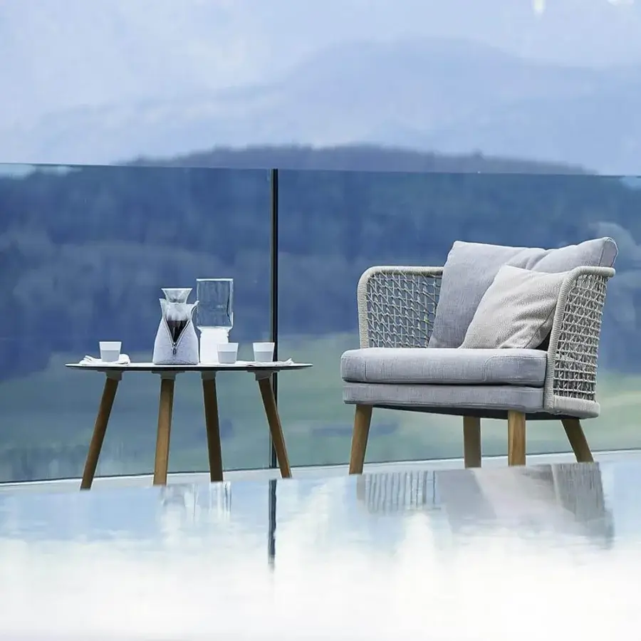 Refined Varaschin Emma coffee table with warm medium-brown wood and smooth satin finish showcasing geometric angled legs