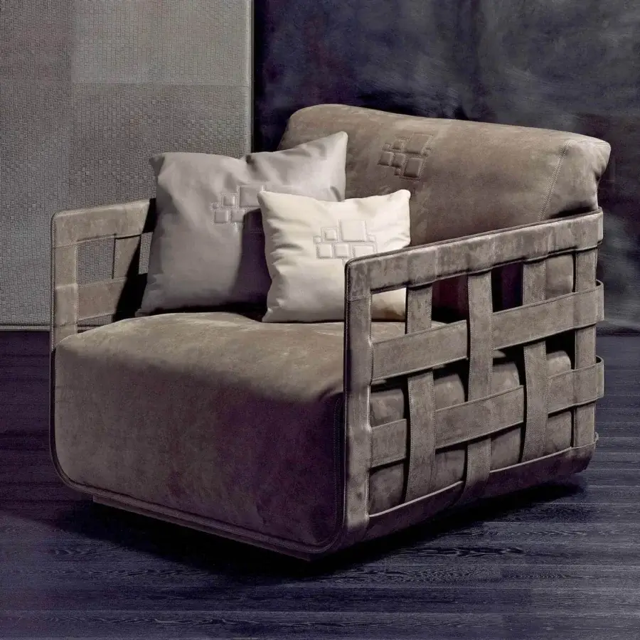 Distinguished Rugiano Braid lounge chair with braided wood and hide-leather frame, upholstered in subtly textured off-white fabric cushions