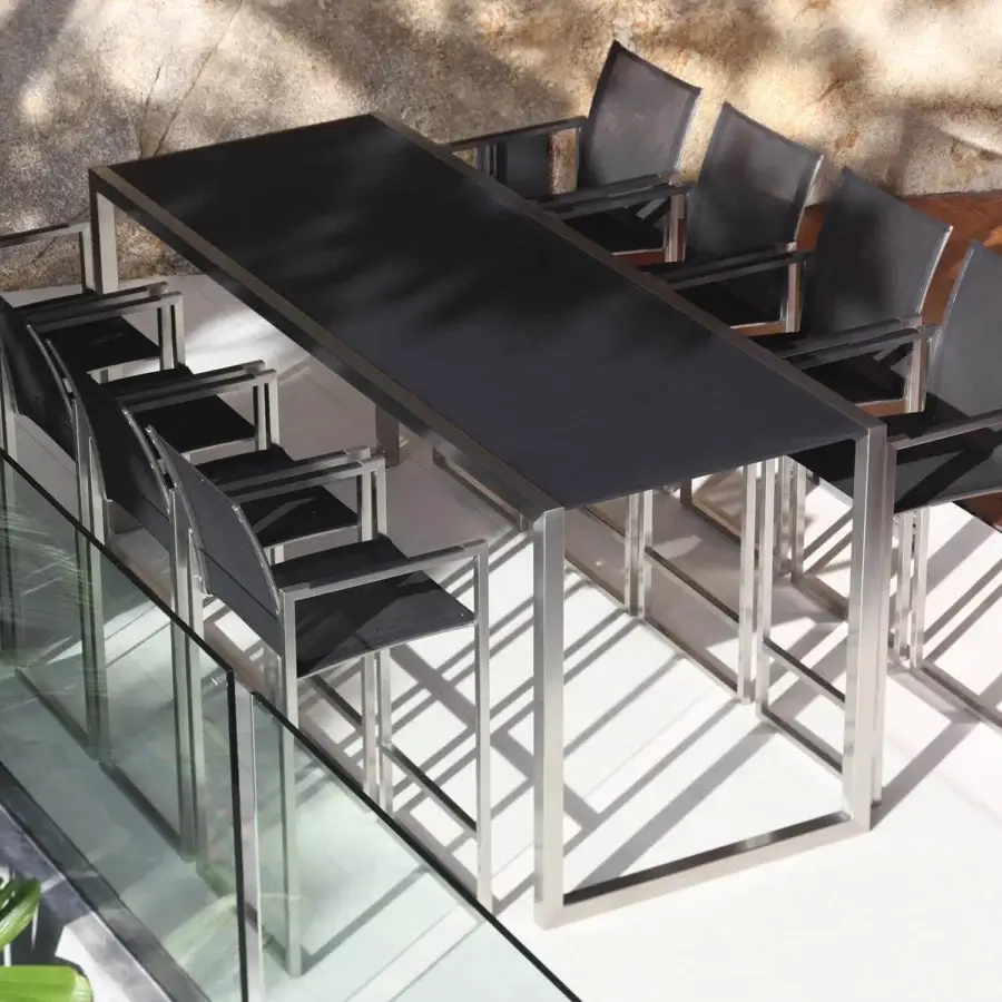 Distinguished Royal Botania Ninix bar table with stainless steel frame and dark gray ceramic tabletop in satin finish