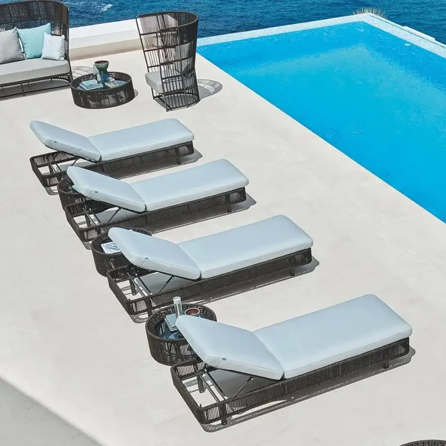 Distinguished Varaschin Tibidabo lounger with a gently curved silhouette in dark brown hand-woven fiber and light blue cushion cover