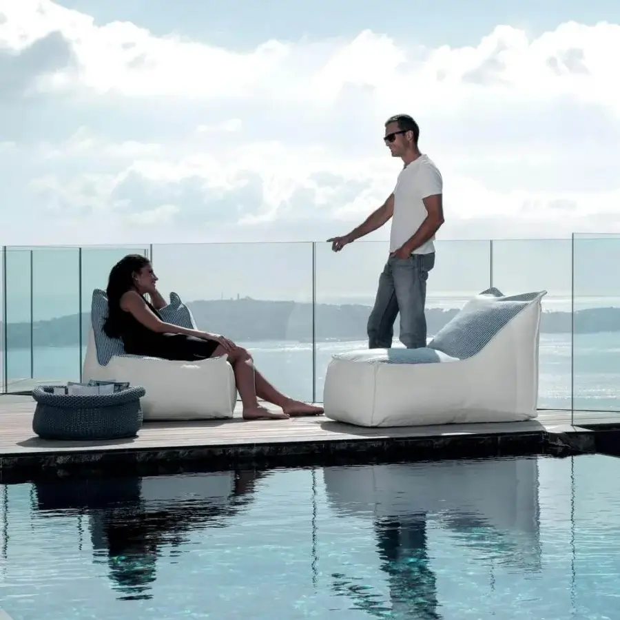 Distinguished Talenti Sacco lounge chair crafted in weather-resistant fabric with vibrant blue and gray patterned cushions and a refined white tone