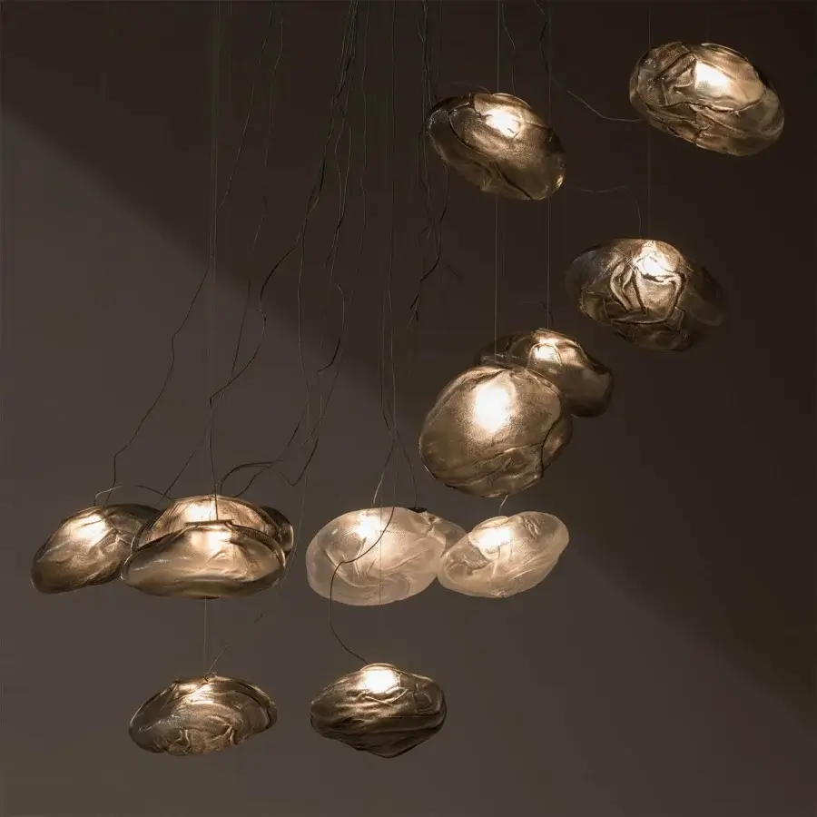 Captivating Bocci 73 suspension lamp crafted in blown glass with braided metal cable and brushed nickel canopy exhibiting a warm golden-bronze tone