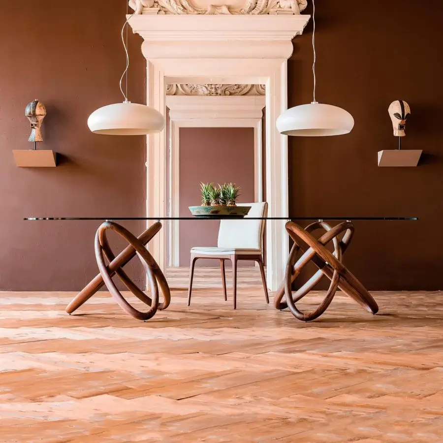 Exceptional Cattelan Italia Carioca table with sculpted Canaletto walnut base and clear glass tabletop in satin finish