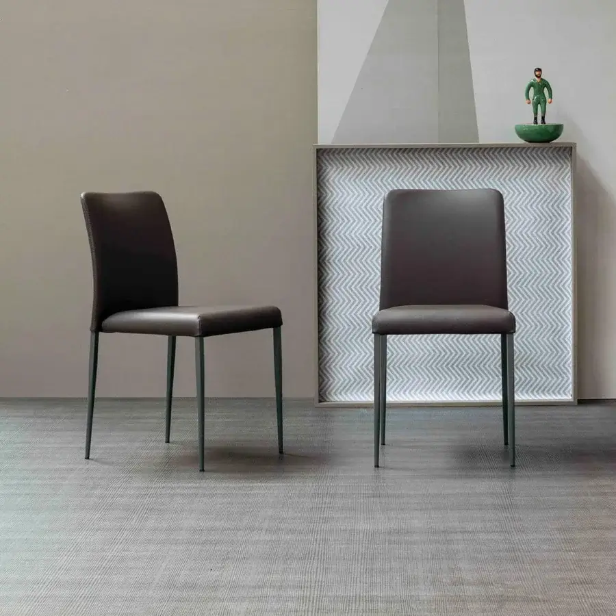Distinguished Bonaldo Deli chair with steel frame, dark gray emery-leather upholstery and black stitching, finished in muted green
