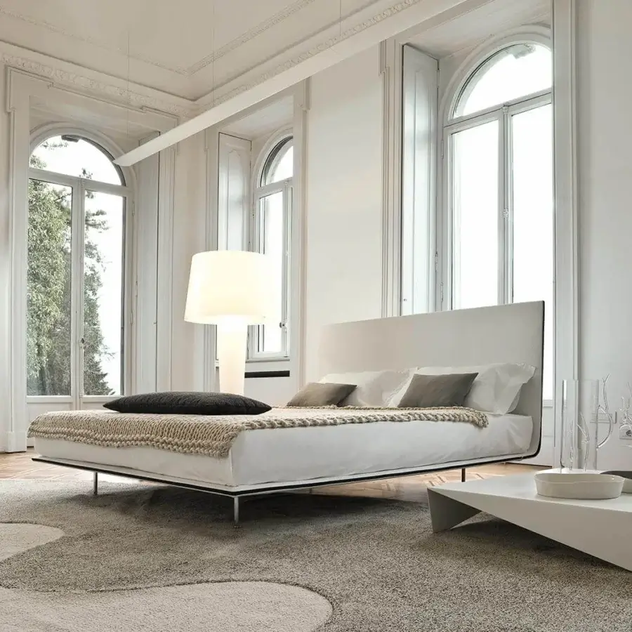 Elegant Bonaldo Thin bed with light-colored fabric upholstery and a smooth matte finish built with a fabric profile detail