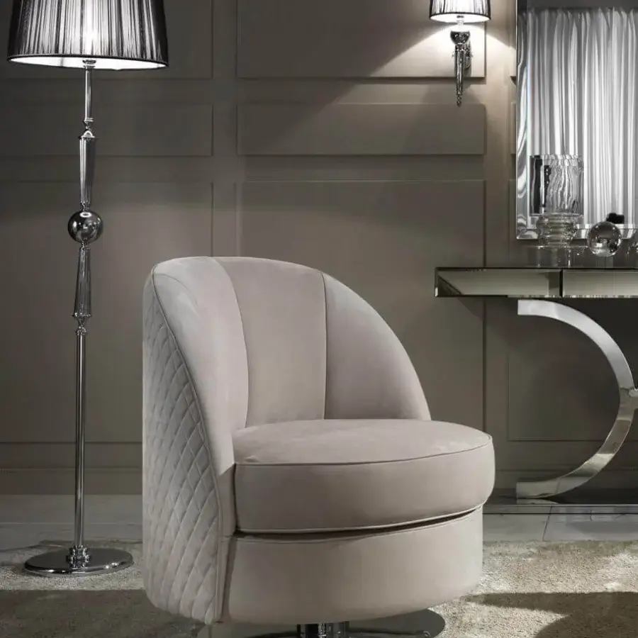 Distinguished DV Home Collection Charlotte lounge chair with neutral beige quilted fabric and shining stainless steel circular base
