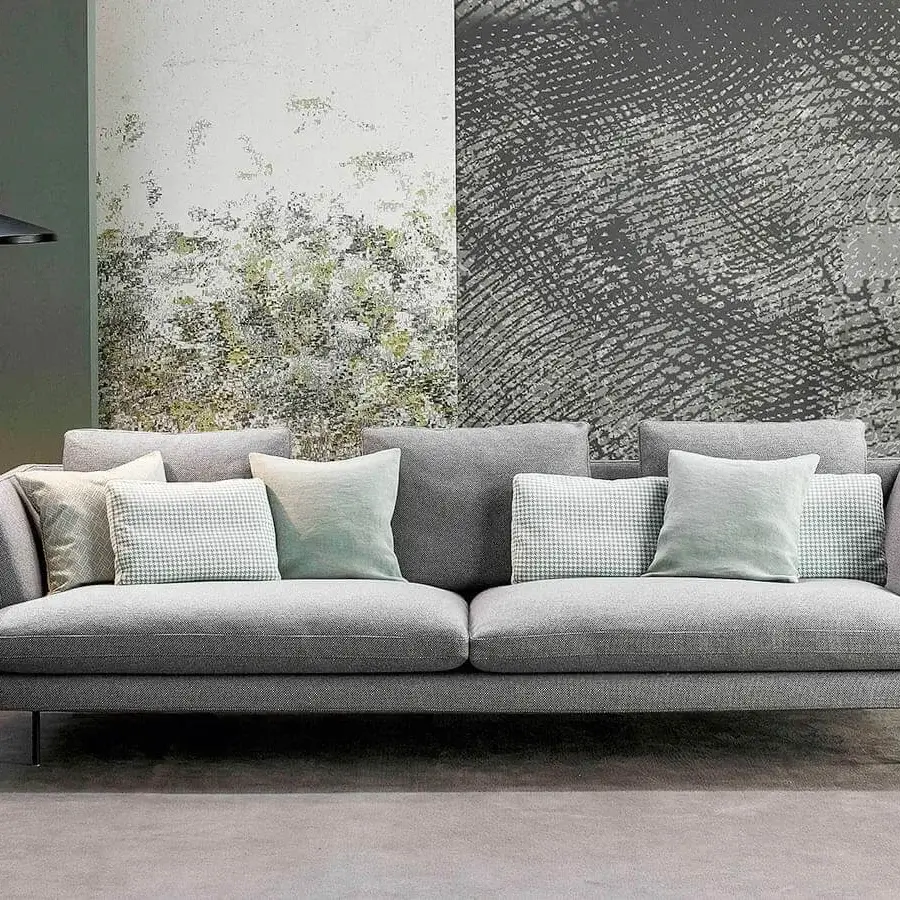 Sophisticated Bonaldo Lars sofa with matte medium gray fabric upholstery and a sleek metal base complemented by coordinating cushions