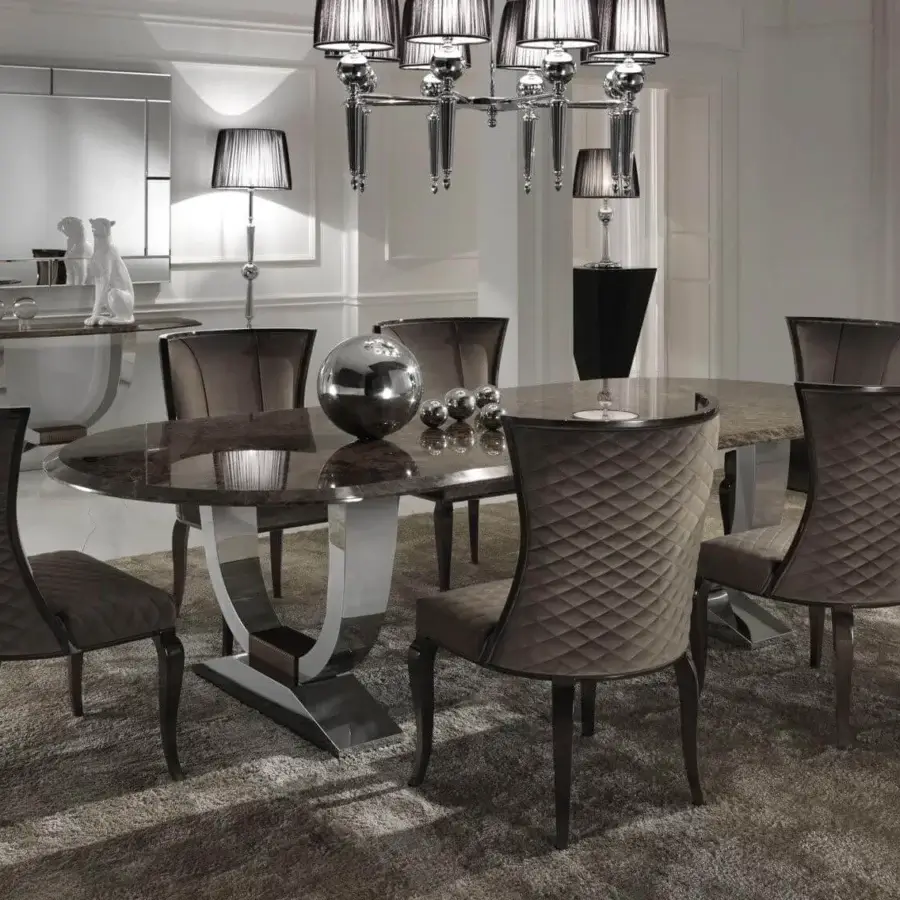 Lavish DV Home Collection Hermes table with a polished marble top and curved stainless steel base