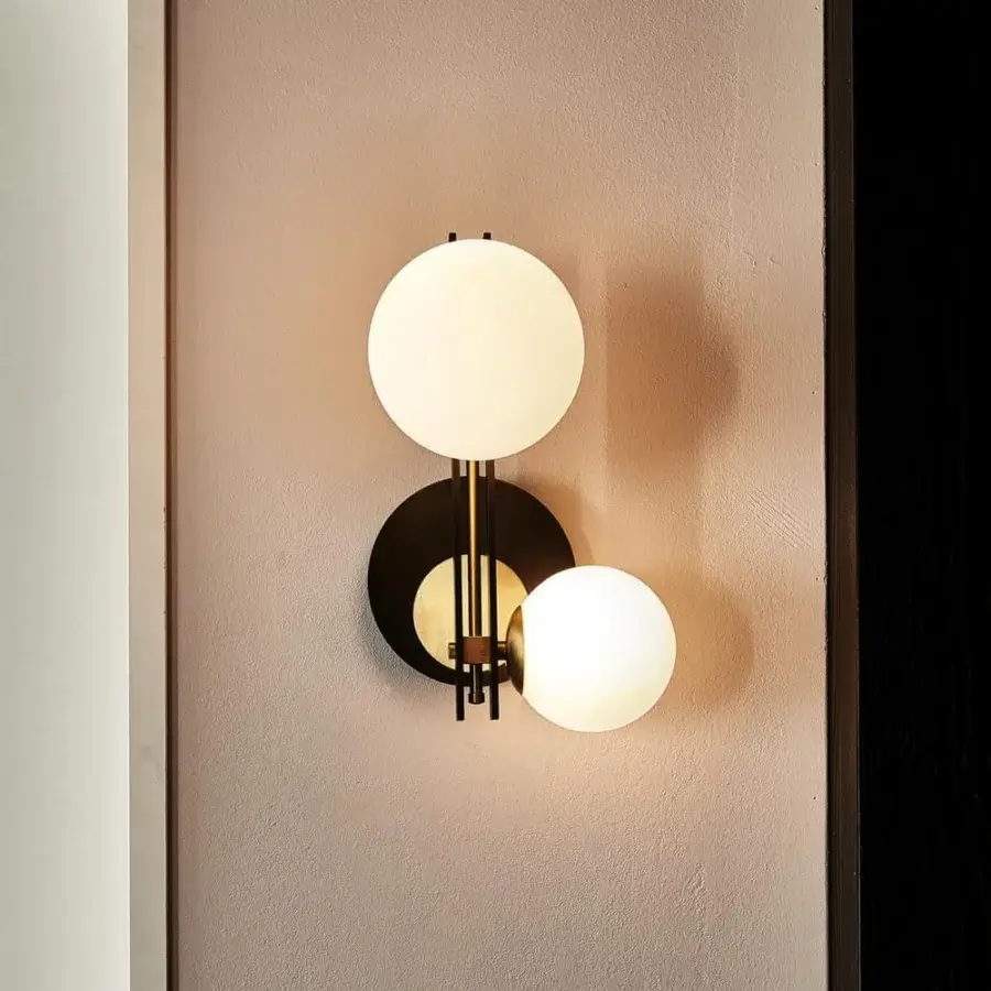 Exceptional Cattelan Italia Planeta wall lamp crafted with burnished steel and brushed brass, showcasing satin white glass shades with a matte black finish