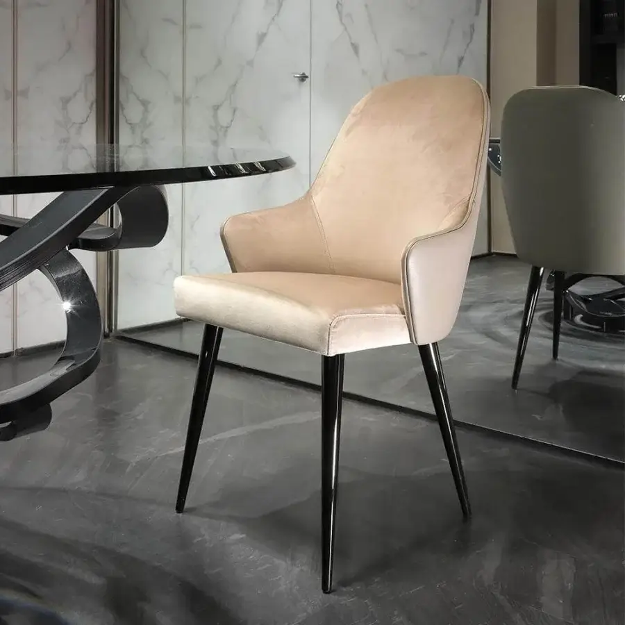 Superior Reflex Ludwig chair with muted beige textile upholstery and dark-toned metal frame, presenting a matte finish
