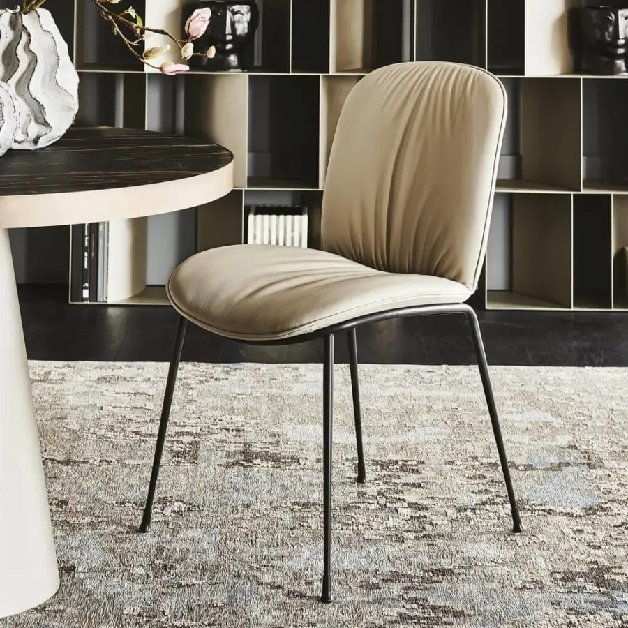 Elegant Cattelan Italia Tina chair with a titanium steel frame and neutral beige fabric upholstery featuring a curved silhouette