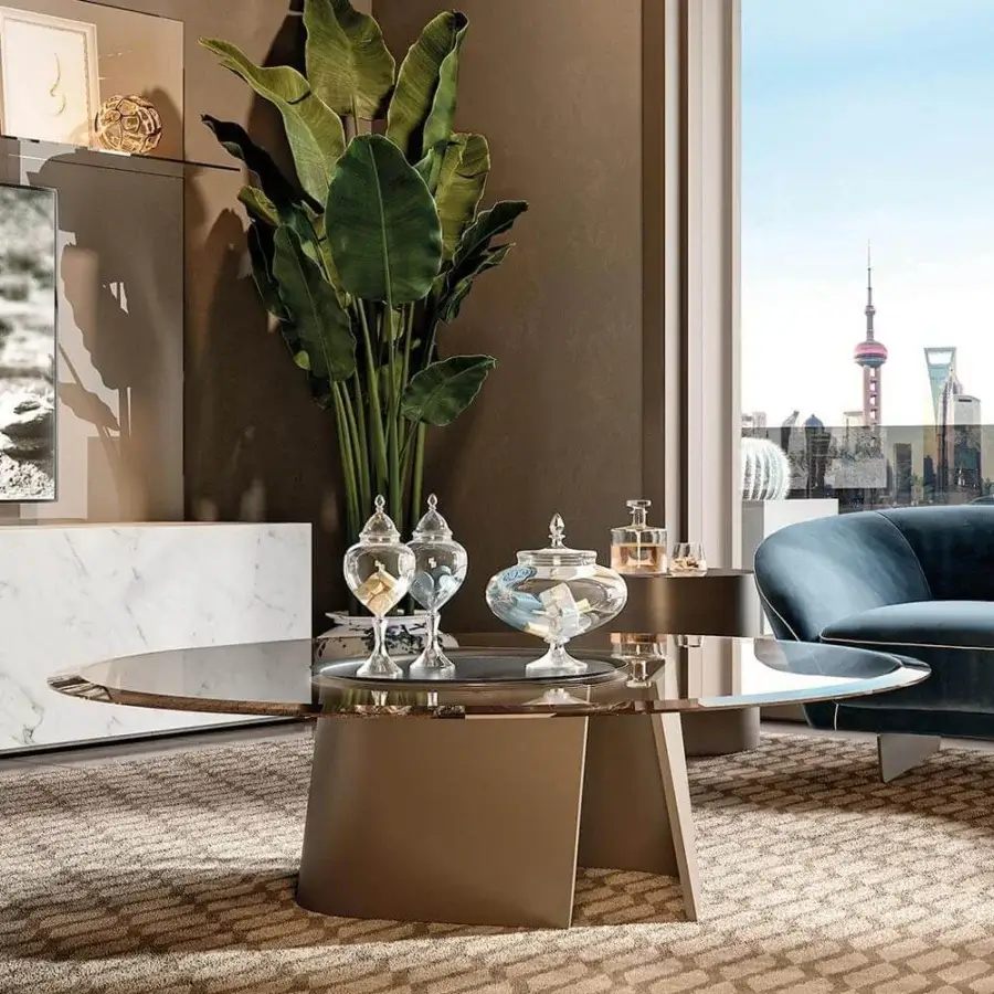 Exceptional Reflex Esse table with a satin brass base and bronze glass top exhibiting a beveled edge