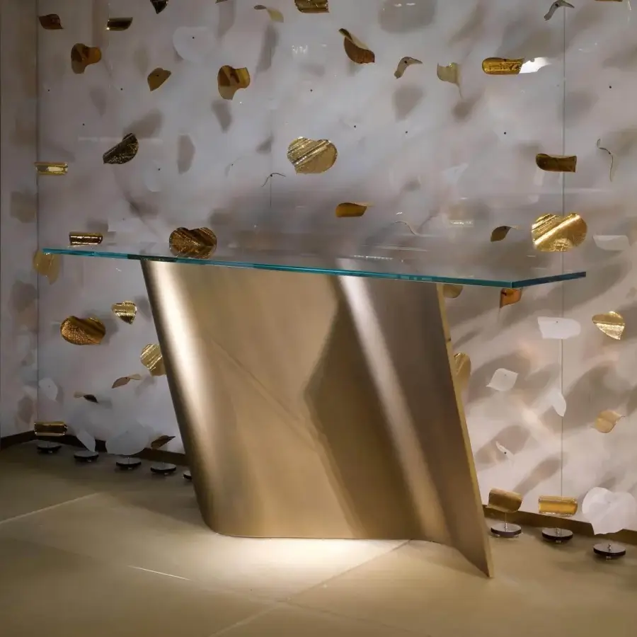 Lavish Reflex Esse console crafted with a satin brass metal base and clear glass tabletop