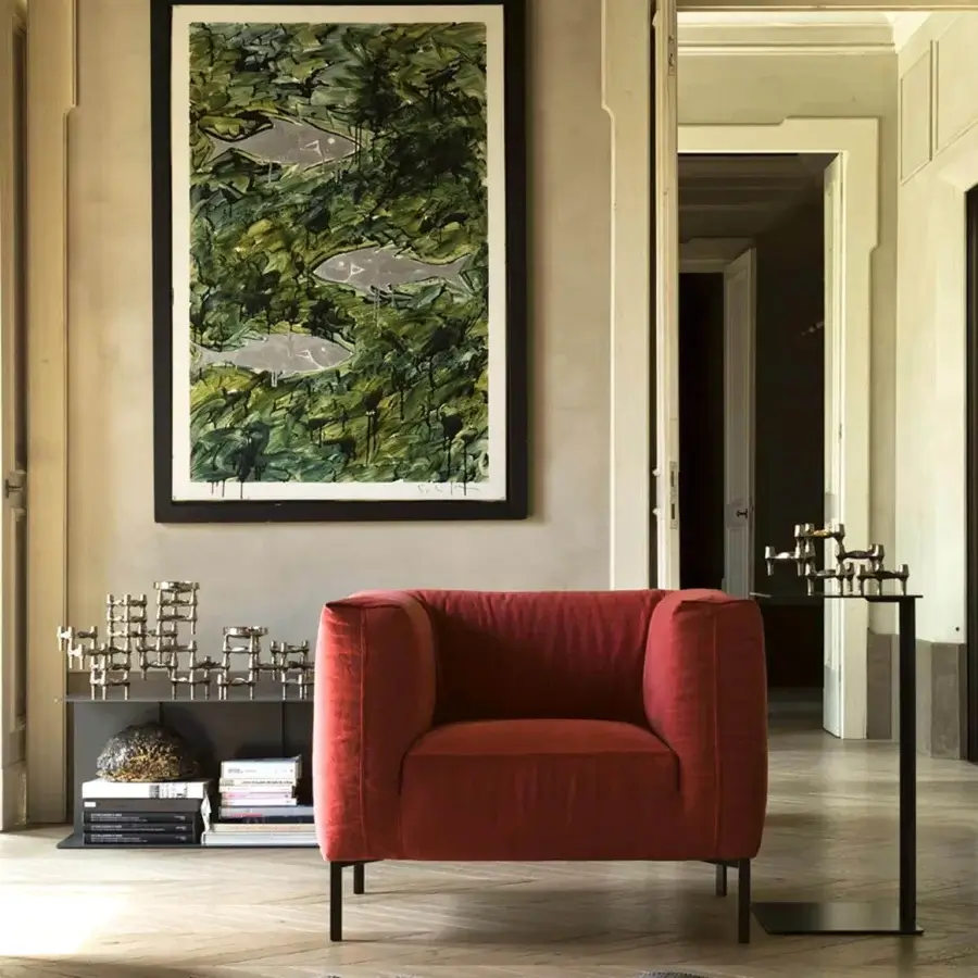 Lavish Verzelloni Fold lounge chair with reddish-orange textile upholstery and dark matte finished legs