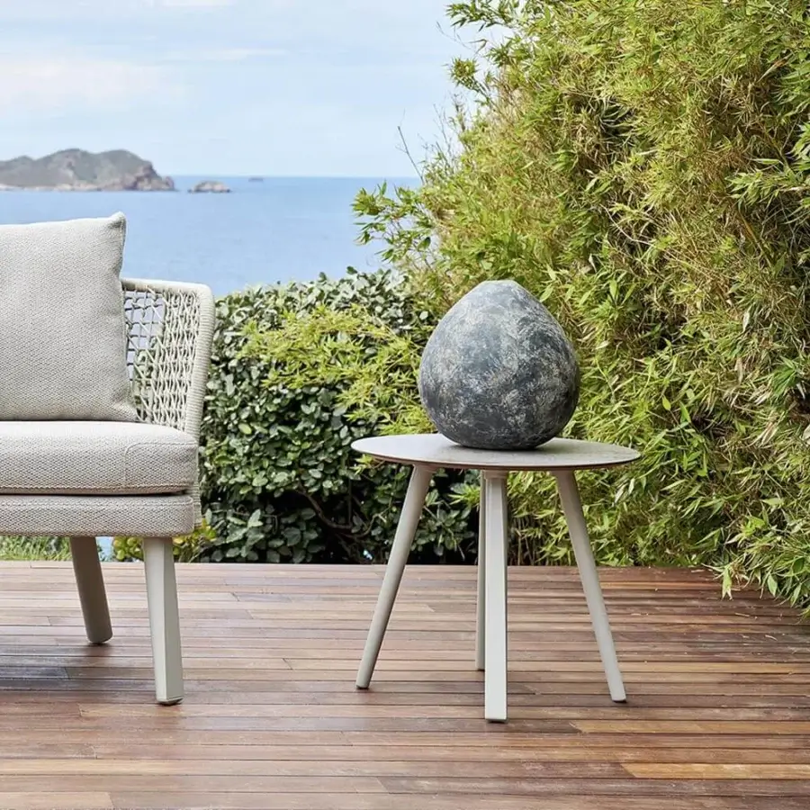 Refined Varaschin Emma side table with aluminum legs and Bush-hammered ceramic tabletop in light gray finish