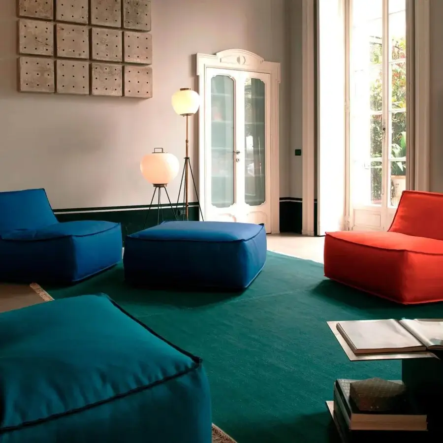 Exceptional Verzelloni Noe lounge chair with vibrant blue textile upholstery and lacquered beech feet