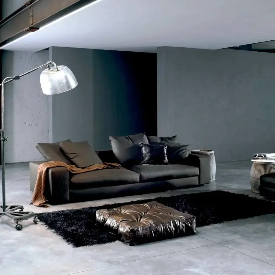 Distinguished Verzelloni Holden sofa with muted gray woven fabric upholstery and matte finish, supported by black-stained beech feet with a golden-brown bolster