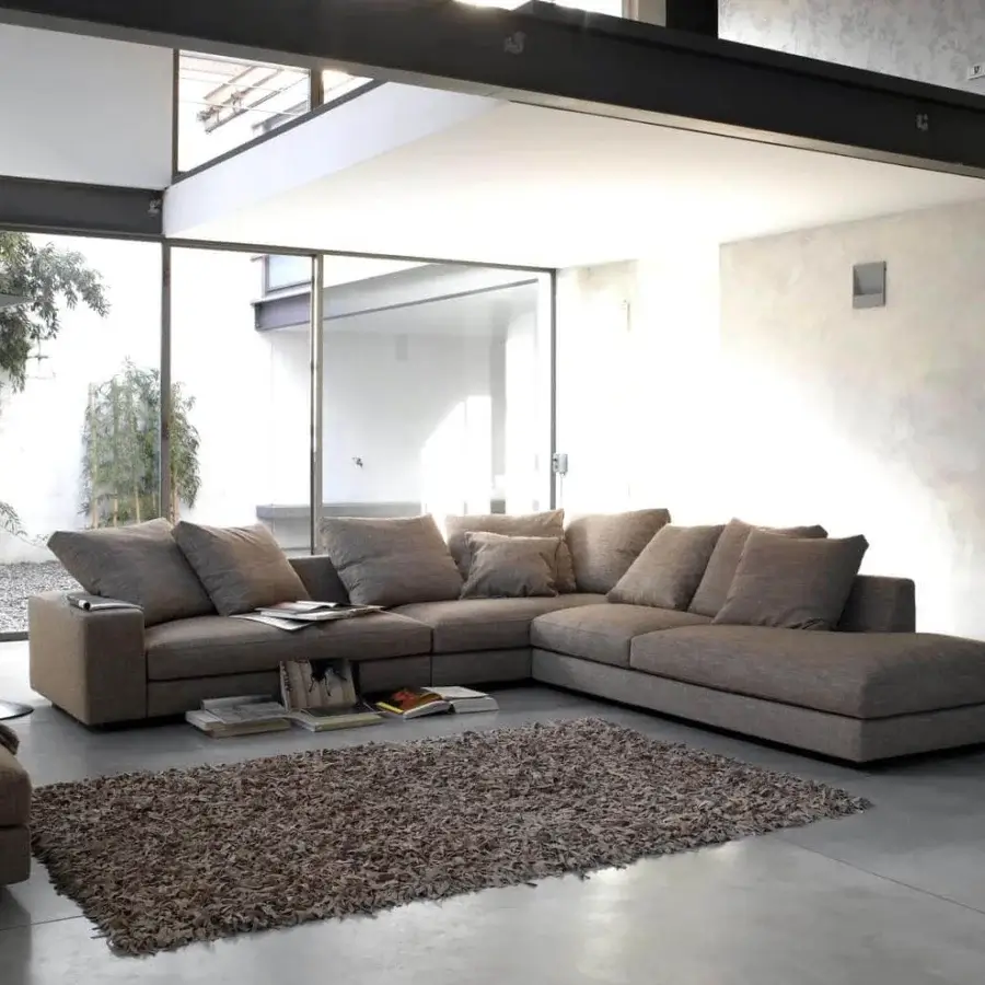 Superior Verzelloni Holden sectional with warm gray textile upholstery and black-stained beech feet